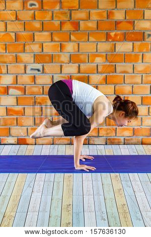 Young woman meditates while practicing yoga. Freedom concept. Calmness and relax woman happiness. Toned picture
