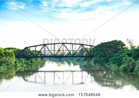 A railway bridge cross over the river in countryside of Thailand