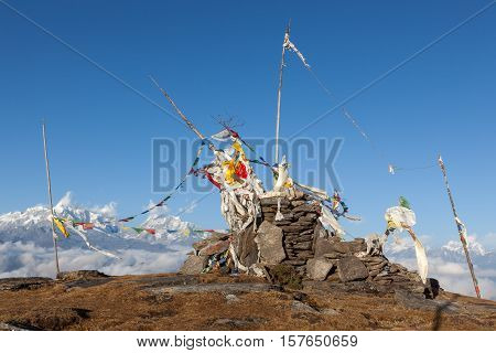 Buddhist Prayer Flags On A Buddhist Chorten In High Himalayan Mountains, Nepal. Waving Buddhist Pray