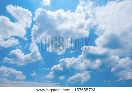 White clouds in a blue sunny sky