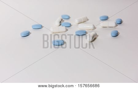 White & Blue Pills on a white background