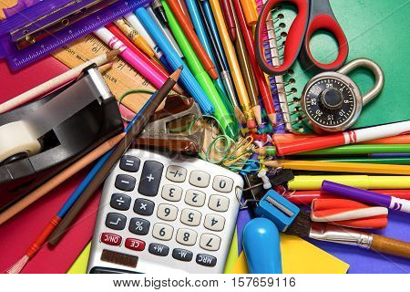 Full background of a colorful assortment of school supplies