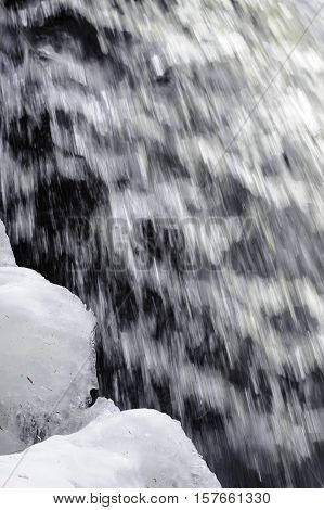 Water falling past growing wall of ice