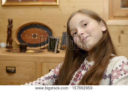 Portrait of a young smiling teenager in home