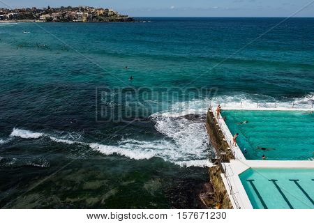 BONDI, AUSTRALIA - APRIL 9, 2016: People swimming at the famous Bondi Beach Icebergs swimming pool