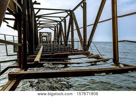 Sosnoviy Bor.Russia.25 july 2016.Abandoned rusty metal pier in the Gulf of Finland in Leningrad region