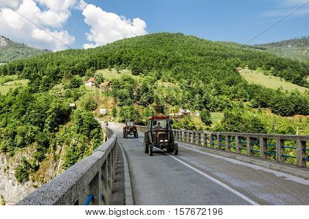 Tara River Canyon.Montenegro.04 June 2015. The tractor ride on the bridge of Dzhurdzhevich over the Tara River Canyon.