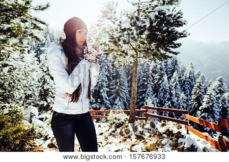 Girl Drinks Tea In Cold Winter Forest With Snow