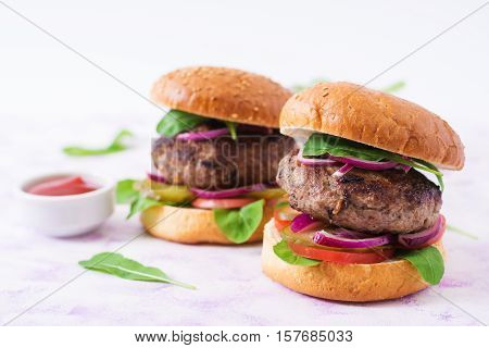 Big Sandwich - Hamburger Burger With Beef, Pickles, Tomato And Red Onions On A Light Background.