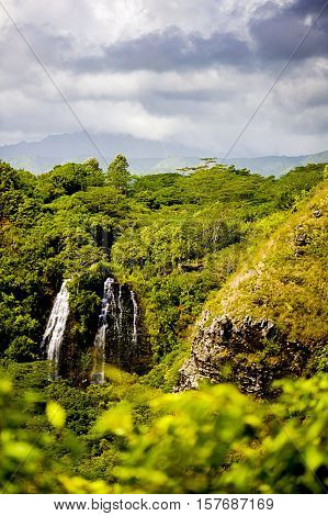 Waterfall deep in the jungle. Rain forests, cliffs, hills, mountains,