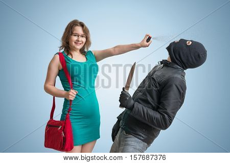 Self Defense Concept. Young Woman Is Defending Herself With Pepp