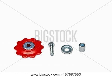 Bicycle red rear derailleur wheel with bolt on white background