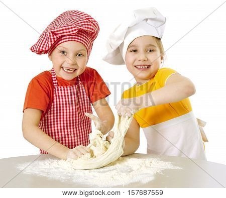 Happy little chefs preparing dough isolated on white
