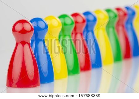 Conceptual game pawns that visualize the concept chain cooperation