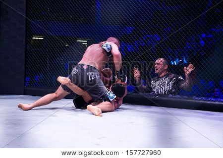 NOVI SAD SERBIA - NOVEMBER 05 2016 : MMA - SBC FIGHT TURNAMENT. ATHLETES IN THE RING EXTREME SPORT. FIGHT NIGHT PROFESIONAL ATHLETESSELECTIVE FOCUS WITH SHALLOW DEPTH OF FIELD NOVEMBER 05 2016 NOVI SAD SERBIA