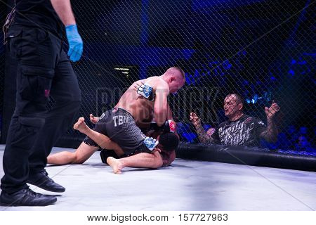 NOVI SAD SERBIA - NOVEMBER 05 2016 : MMA - SBC FIGHT TURNAMENT. ATHLETES IN THE RING EXTREME SPORT. FIGHT NIGHT PROFESIONAL ATHLETESSELECTIVE FOCUS WITH SHALLOW DEPTH OF FIELD NOVEMBER 05 2016 NOVI SAD SERBIA