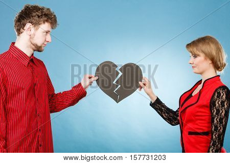 Young Pair Fixing Heart.