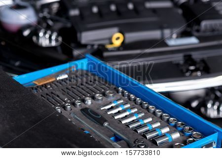 Necessary stuff. Close up of numerous wrenches for car reparing lying on the table in auto service center