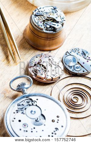 Opened Clocks And Internals On A Table