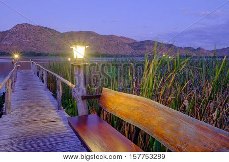 the lamp on the wood bridge go to the lake and mountain