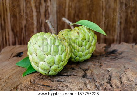 fresh custard apple on wooden table background