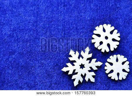Christmas decoration.Snowflakes on blue background with copyspace.Christmas snowflakes.Snowflakes background.Top view.Winter holidays,Christmas or Happy New Year concept.