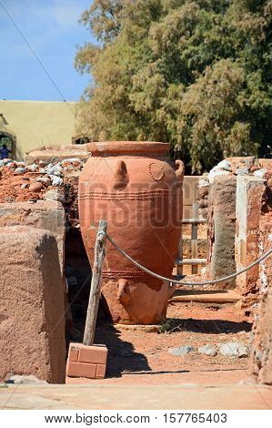 Ancient large decorated terracotta pot within the walls of the Minoan Malia ruins archaeological site Malia Crete Greece Europe.