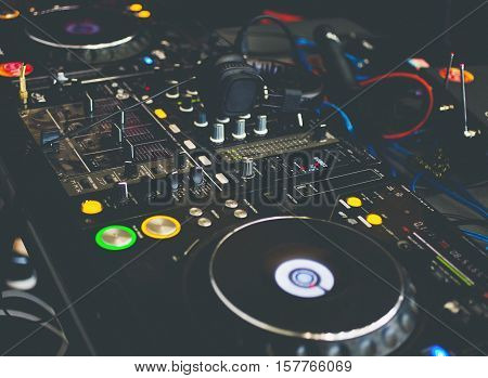 Close up DJ console with DJ headphones.