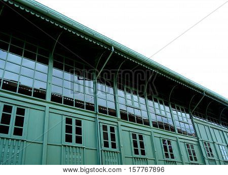 Angle view of big green building on white background