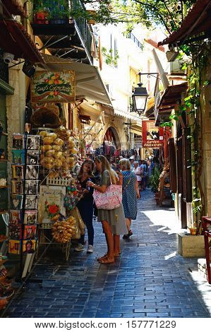 RETHYMNO, CRETE - SEPTEMBER 15, 2016 - Tourists along a shopping street in the old town Rethymno Crete Greece Europe, September 15, 2016.