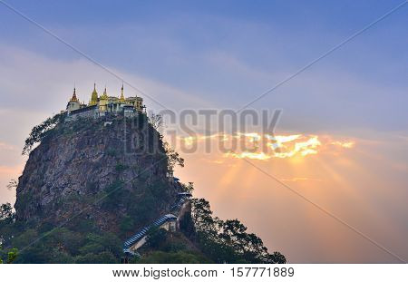 Mount Popa at dawn, Mt. Popa near Bagan, Mandalay, Myanmar. Popa monastery, Popa inactive volcano. Soft focus due to long exposure. Natural lights.