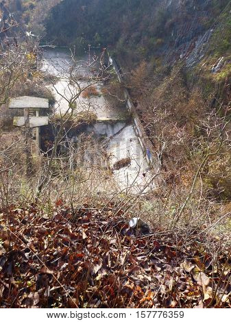 Decayed Empty Swimming Pool With Concrete Tower