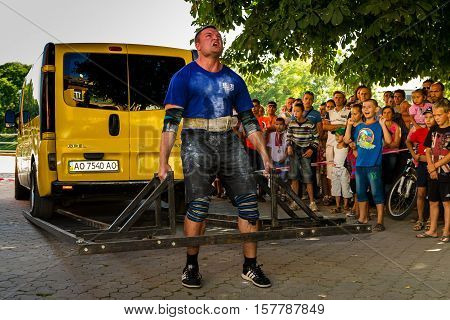 Uzhgorod Ukraine - August 28 2016: Strongmen perform exercise during the 13th power tournament 