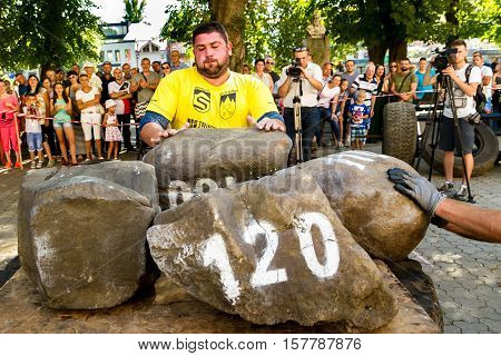 Uzhgorod Ukraine - August 28 2016: Strongmen perform exercise during the 13th power tournament 