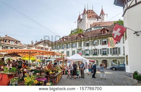 THUN,SWITZERLAND - SEPTEMBER 3,2016 - View at the market place with Castle of Thun. Thun is a town and a municipality in the administrative district of Thun in the canton of Bern in Switzerland.