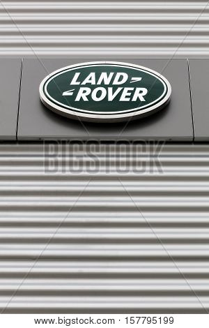 Kolding, Denmark - May 29, 2016: Land Rover logo on a wall. Land Rover is a car brand that specialises in four-wheel-drive vehicles, owned by British multinational car manufacturer Jaguar Land Rover