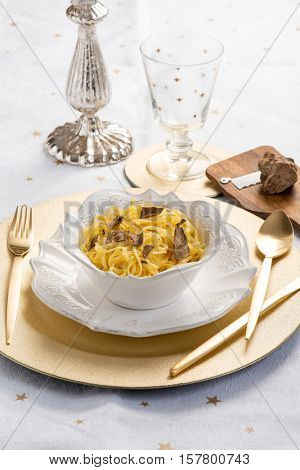 tagliolini with white truffle over christmas table