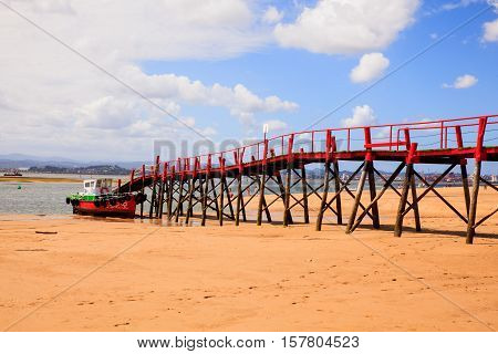 View of jetty in the El Puntal beach in Somo Santander. Spain