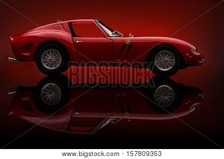 KRIVOY ROG, UKRAINE - OCT 29 - Toy Ferrari 250 GTO on background. Photo made in the studio, Saturday 29 October 2016