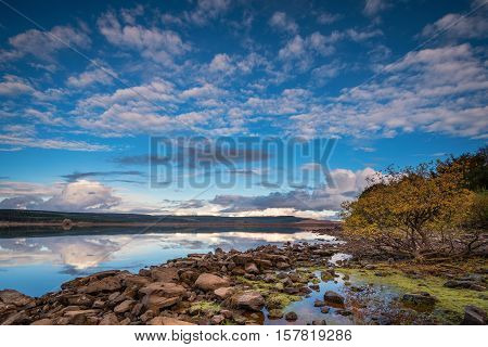 Kielder Dam and shoreline, in Kielder Water and Forest Park, Northumberland, which has the largest man made lake in Northern Europe. The reservoir sits in the North Tyne Valley with the river flowing through it