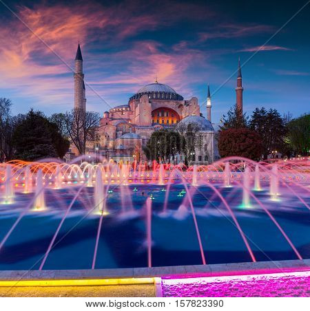 Colorful Spring Sunset In Sultan Ahmet Park In Istanbul, Turkey, Europe. Colorful Fountain On The Ba