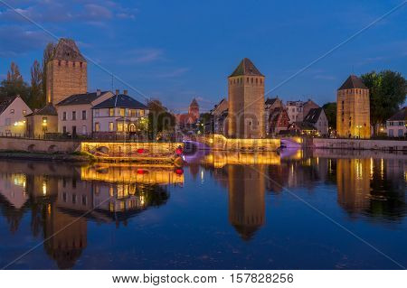 medieval bridge Ponts Couverts of Strasbourg at night, France