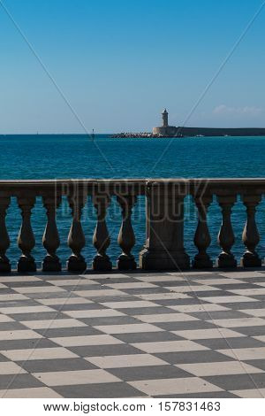 Livorno' s Mascagni Terrace and White LightHouse in background Tuscany - Italy
