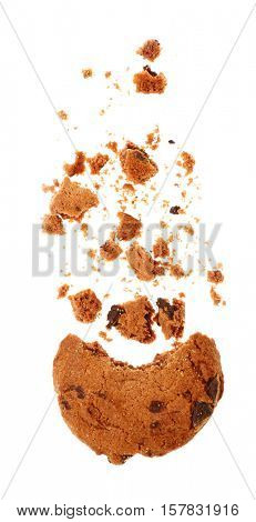 Tasty cookie with chocolate chips and crumbs on white background
