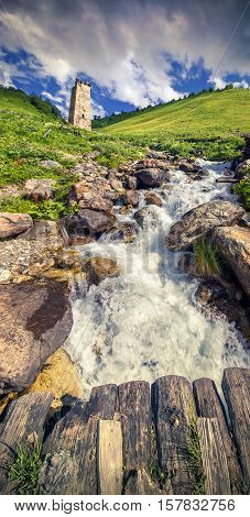 Famous Tower Svaneti. Mountain stream in the village Adishi. Georgia Upper Svaneti.