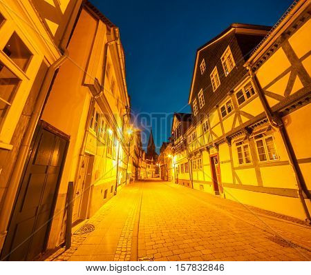 Colorful night scene in the Wolfenbuttel village. Facade of the authentic fahverk houses. Wolfenbuttel Germany Europe.