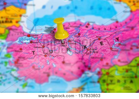 Ankara capital city in Turkey pinned on colorful political map of europe. Geopolitical school atlas. Tilt shift effect.