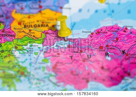 Istanbul city in Turkey pinned on colorful political map of europe. Geopolitical school atlas. Tilt shift effect.