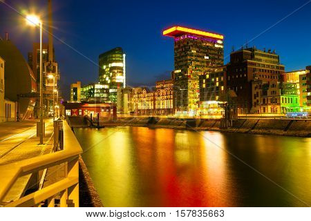 Colorful Night Scene Of Rhein River At Night In Dusseldorf