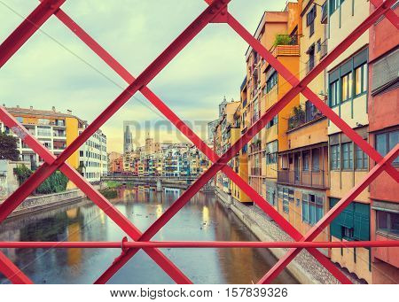 historical jewish quarter in Girona, view through Eiffel Bridge at sunrise, Barcelona, Spain, Catalonia